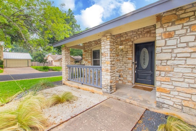 2400 Braemar Cv, Austin, TX 78747 - entrance to property with a porch and stone siding