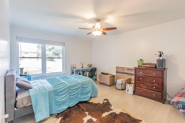 2400 Braemar Cv, Austin, TX 78747 - bedroom with wood finished floors, ornamental molding, and ceiling fan