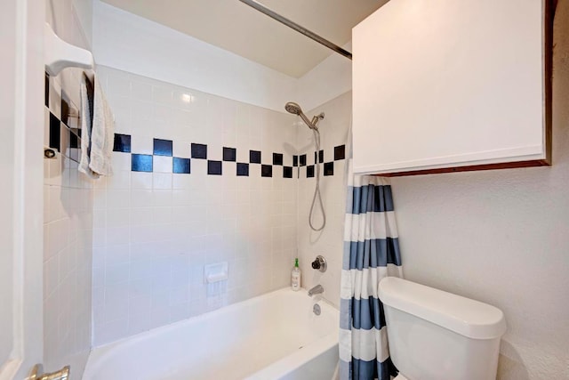bathroom featuring toilet and shower / bath combo