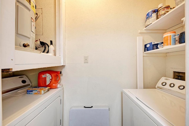 laundry room featuring independent washer and dryer and laundry area