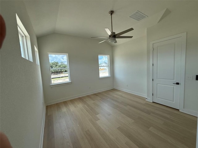 12009 Cearley Dr, Austin, TX 78758 - spare room with vaulted ceiling, light wood finished floors, and ceiling fan
