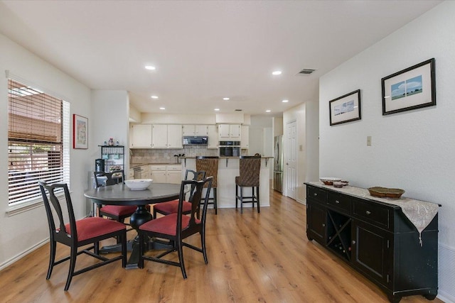 7809 Taranto Dr, Austin, TX 78729 - dining space featuring light wood-style floors and recessed lighting