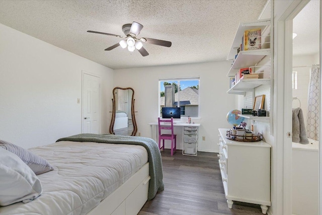 7809 Taranto Dr, Austin, TX 78729 - bedroom featuring a textured ceiling, dark wood-type flooring, and ceiling fan