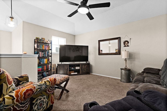 living area featuring baseboards, vaulted ceiling, a ceiling fan, and carpet floors