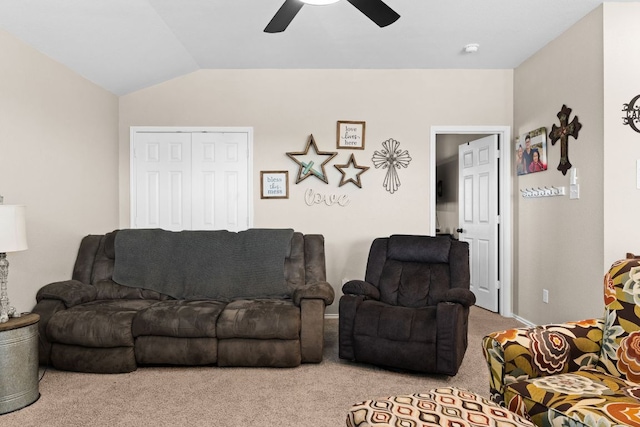 carpeted living room featuring a ceiling fan and lofted ceiling