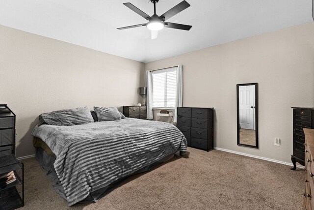 bedroom featuring baseboards, a ceiling fan, carpet, and lofted ceiling