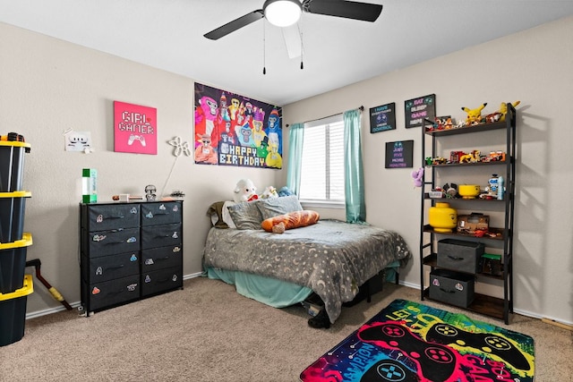 carpeted bedroom featuring ceiling fan and baseboards