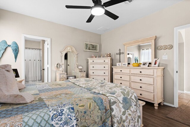 bedroom with visible vents, baseboards, ceiling fan, and dark wood-style floors