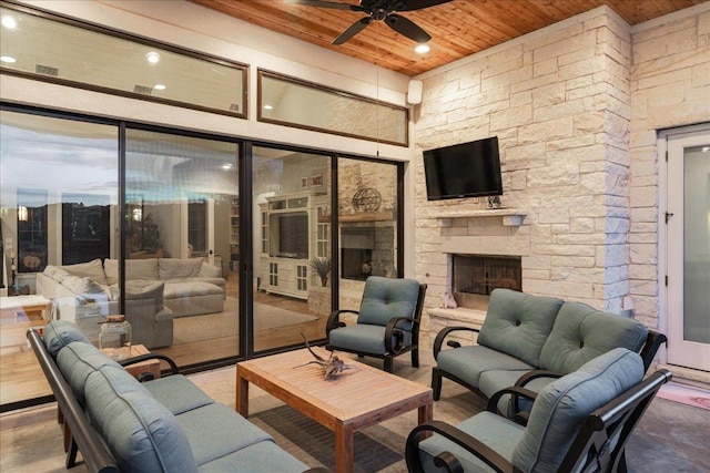 821 S Angel Light Dr, Spicewood, TX 78669 - view of patio with an outdoor living space with a fireplace and a ceiling fan