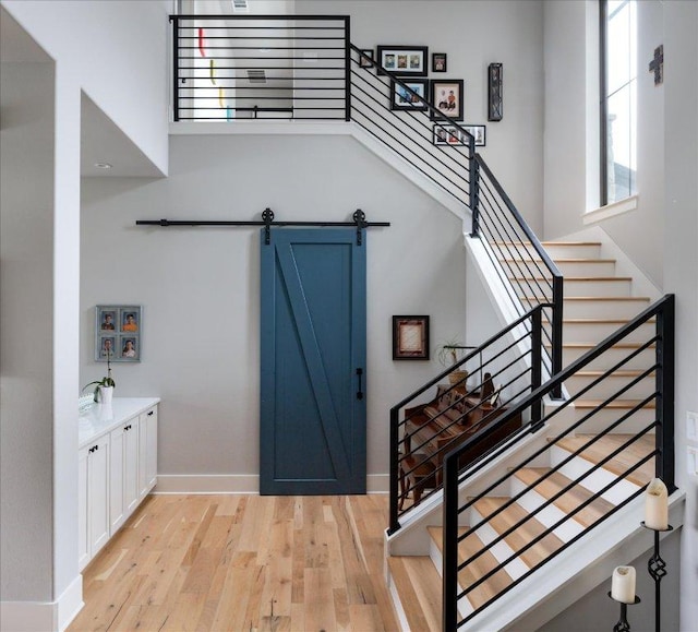 821 S Angel Light Dr, Spicewood, TX 78669 - foyer with light wood-type flooring and stairway
