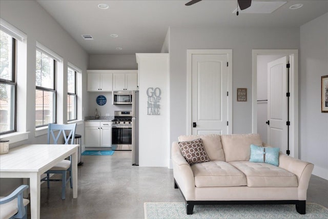 821 S Angel Light Dr, Spicewood, TX 78669 - living area featuring a ceiling fan, concrete floors, and recessed lighting