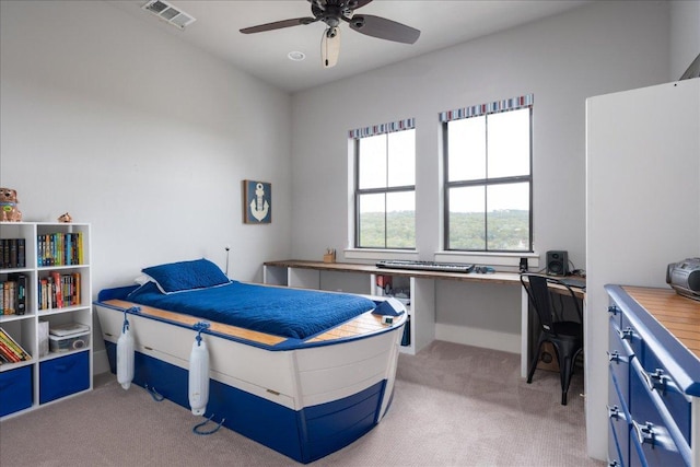 821 S Angel Light Dr, Spicewood, TX 78669 - bedroom with light carpet, an office area, and ceiling fan