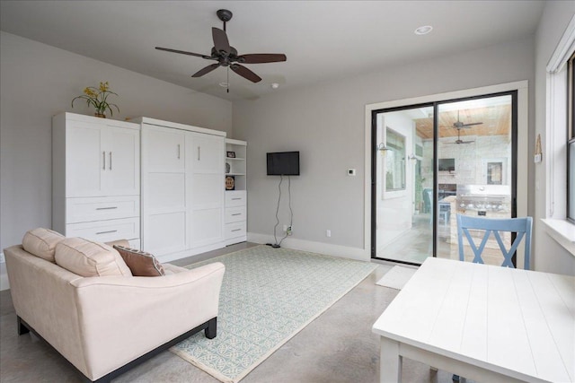821 S Angel Light Dr, Spicewood, TX 78669 - living room with a ceiling fan, baseboards, and concrete floors