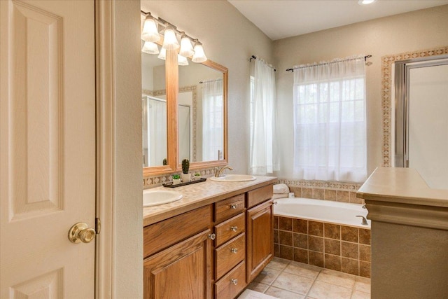 22230 Stow Cir, Spicewood, TX 78669 - bathroom with a garden tub, double vanity, tile patterned flooring, and a stall shower