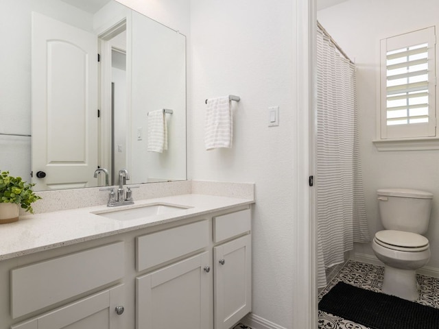 1491 Hazy Hills Loop, Dripping Springs, TX 78620 - bathroom featuring toilet, vanity, and baseboards
