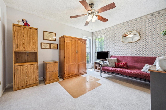 59 Fairview Dr, Round Rock, TX 78665 - living room with wallpapered walls, light colored carpet, ceiling fan, and a textured ceiling