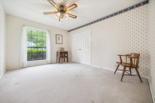 59 Fairview Dr, Round Rock, TX 78665 - bedroom with carpet, a textured ceiling, a closet, and ceiling fan