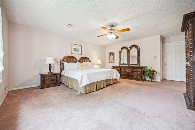 59 Fairview Dr, Round Rock, TX 78665 - bedroom featuring carpet, ceiling fan, and a textured ceiling