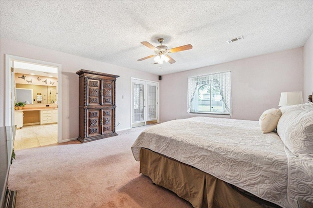 59 Fairview Dr, Round Rock, TX 78665 - bedroom featuring light colored carpet, access to outside, a textured ceiling, ceiling fan, and connected bathroom