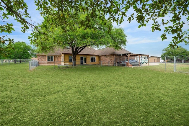 59 Fairview Dr, Round Rock, TX 78665 - back of house featuring brick siding and a fenced backyard