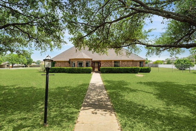 59 Fairview Dr, Round Rock, TX 78665 - view of front facade featuring brick siding and a shingled roof