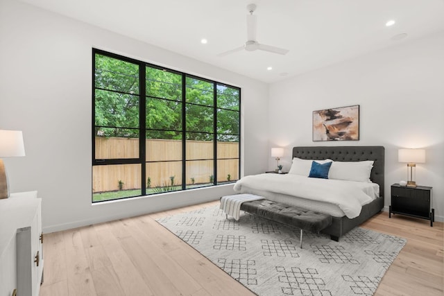 bedroom featuring light wood-style flooring, recessed lighting, and baseboards