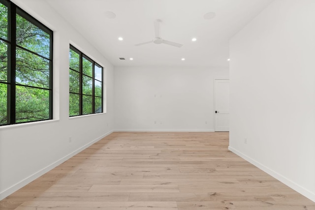 spare room with visible vents, baseboards, a ceiling fan, light wood-style floors, and recessed lighting