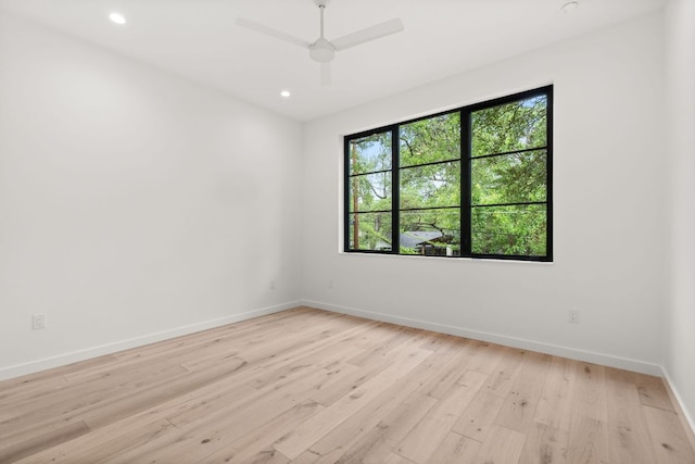 unfurnished room with recessed lighting, light wood-style flooring, baseboards, and ceiling fan
