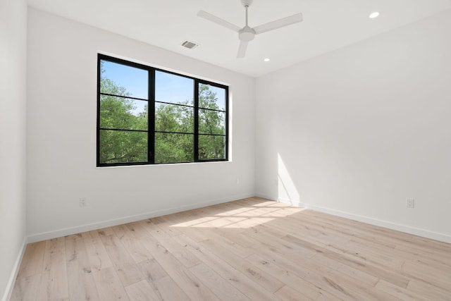 empty room featuring baseboards, recessed lighting, ceiling fan, and light wood-style floors