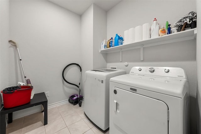 365 Capstone Rd, Liberty Hill, TX 78642 - clothes washing area with laundry area, light tile patterned floors, baseboards, and washer and clothes dryer