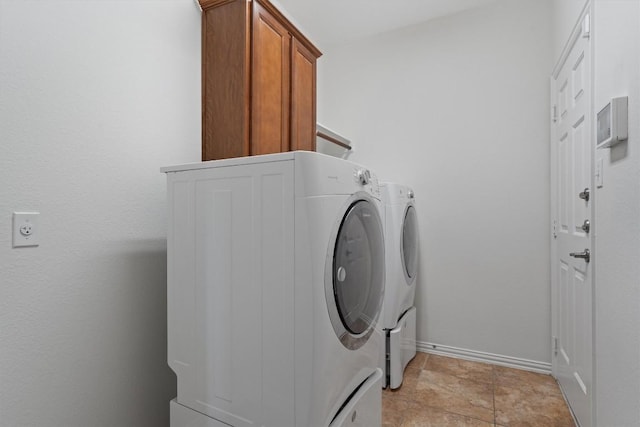 2529 Mirasol Loop, Round Rock, TX 78681 - washroom featuring separate washer and dryer, cabinet space, and baseboards