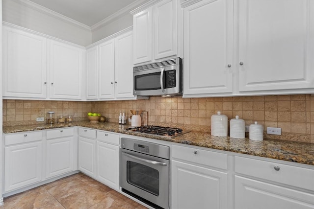 2529 Mirasol Loop, Round Rock, TX 78681 - kitchen featuring stainless steel appliances, dark stone counters, crown molding, and white cabinetry