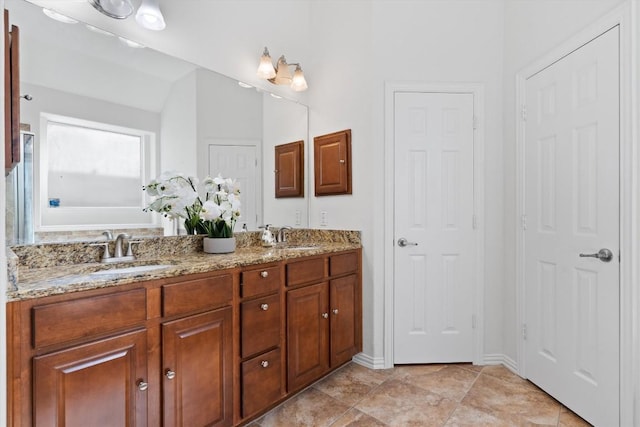2529 Mirasol Loop, Round Rock, TX 78681 - full bathroom featuring double vanity, a bath, and baseboards
