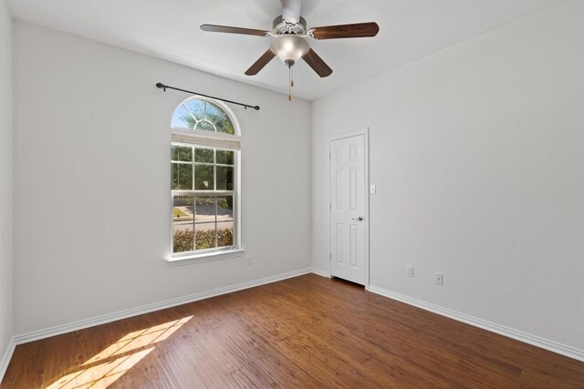 2529 Mirasol Loop, Round Rock, TX 78681 - empty room featuring wood finished floors, baseboards, and ceiling fan
