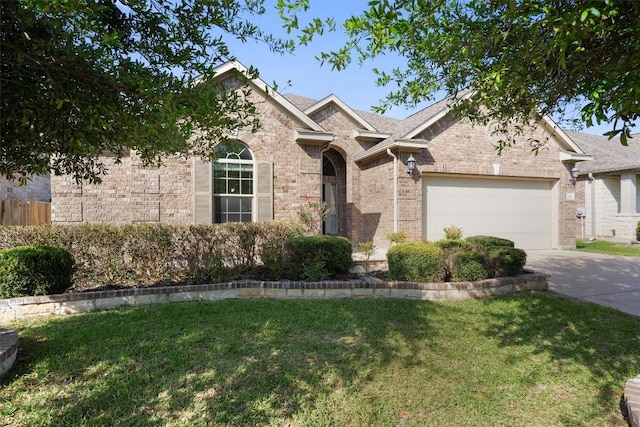 2529 Mirasol Loop, Round Rock, TX 78681 - traditional-style home featuring concrete driveway, a front lawn, an attached garage, and brick siding
