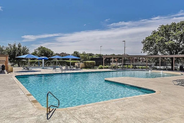 2529 Mirasol Loop, Round Rock, TX 78681 - community pool featuring a patio