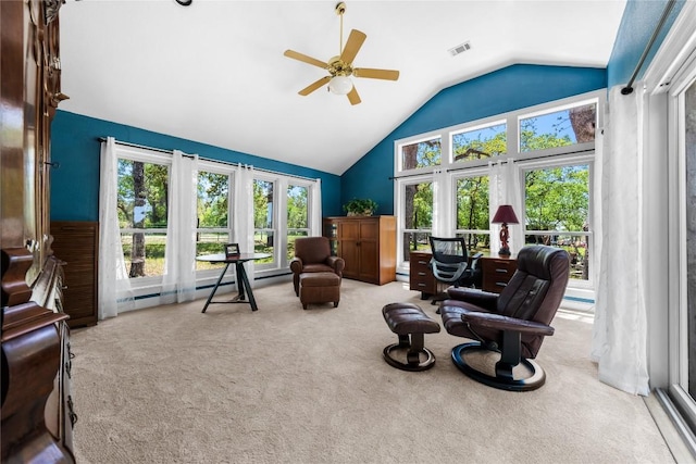 living area featuring carpet, visible vents, a ceiling fan, and lofted ceiling