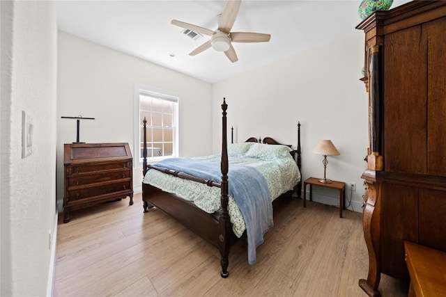 bedroom with light wood-style floors, ceiling fan, and visible vents