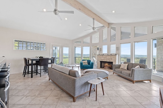 living area featuring high vaulted ceiling, beam ceiling, a ceiling fan, and a wealth of natural light