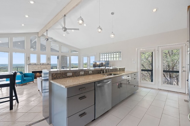 kitchen featuring a sink, open floor plan, a ceiling fan, gray cabinets, and dishwasher