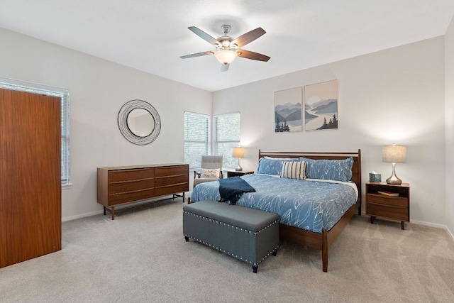 bedroom with baseboards, carpet floors, and ceiling fan