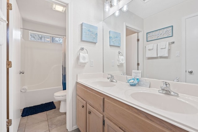 21726 Sierra Trl, Lago Vista, TX 78645 - full bath with toilet, double vanity, shower / bath combo with shower curtain, and tile patterned flooring