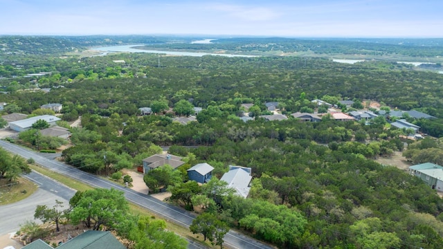 bird's eye view featuring a wooded view