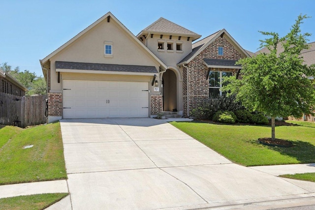 view of front of house featuring concrete driveway, fence, a front yard, a garage, and stucco siding