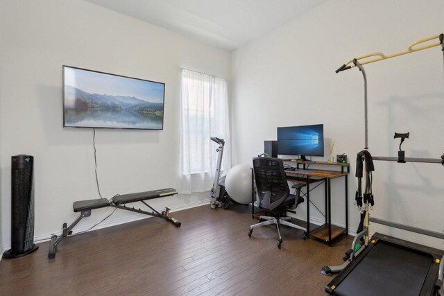 office featuring baseboards and wood finished floors