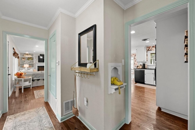 1403 E 16th St, Georgetown, TX 78626 - corridor with wood finished floors and crown molding