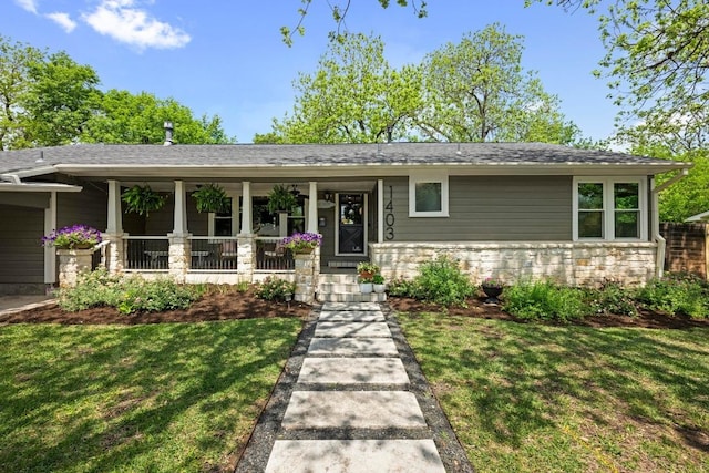 1403 E 16th St, Georgetown, TX 78626 - view of front of home with a porch, a front lawn, and a shingled roof