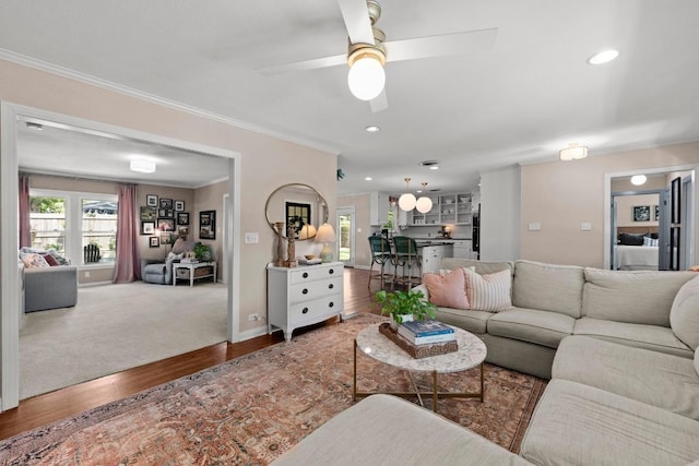 1403 E 16th St, Georgetown, TX 78626 - living area with ornamental molding, wood finished floors, a ceiling fan, recessed lighting, and baseboards