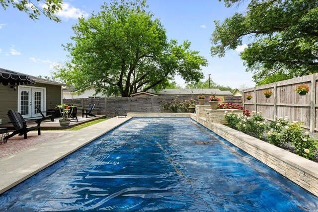 1403 E 16th St, Georgetown, TX 78626 - view of swimming pool with french doors, a fenced backyard, and a patio