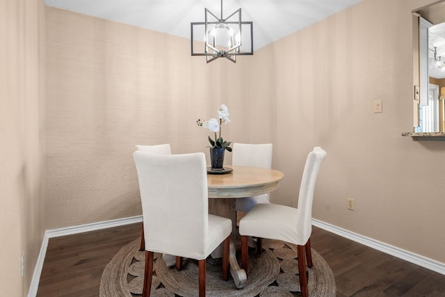 8200 Neely Dr Unit 217, Austin, TX 78759 - dining room with a chandelier, dark wood-type flooring, and baseboards